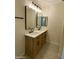 Modern bathroom with double vanity and updated light fixtures at 9814 N Balboa Dr, Sun City, AZ 85351