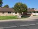 Single story home with carport and well-maintained landscaping at 9814 N Balboa Dr, Sun City, AZ 85351