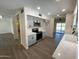 Modern kitchen with gray cabinets, quartz countertops, and stainless steel appliances at 9814 N Balboa Dr, Sun City, AZ 85351