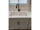 Double sink with modern black faucet and white quartz countertop at 9814 N Balboa Dr, Sun City, AZ 85351