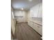 Laundry room with washer/dryer hookups and cabinets at 9814 N Balboa Dr, Sun City, AZ 85351