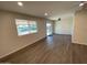 Open living room showcasing wood-look floors and a view at 9814 N Balboa Dr, Sun City, AZ 85351