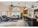 Kitchen boasts a breakfast bar and dark wood cabinetry at 10043 E Dreyfus Ave, Scottsdale, AZ 85260