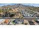 Aerial view showing the home's location in a residential neighborhood near mountains at 1246 E Vista Ave, Phoenix, AZ 85020