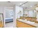 Elegant bathroom with double sinks and a view into a bedroom at 140 E Rio Salado Pkwy # 506, Tempe, AZ 85281