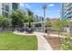 Outdoor kitchen with grill, tables, and seating area at 140 E Rio Salado Pkwy # 506, Tempe, AZ 85281