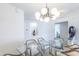 Bright dining room with glass table, chandelier, and modern decor at 140 E Rio Salado Pkwy # 506, Tempe, AZ 85281