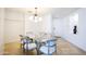 Modern dining room features glass table and chandelier at 140 E Rio Salado Pkwy # 506, Tempe, AZ 85281