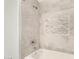 Updated bathroom with a bathtub and marble tile shower surround at 15225 N 100Th St # 2187, Scottsdale, AZ 85260