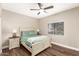 Cozy bedroom with ceiling fan and wood floors at 15225 N 100Th St # 2187, Scottsdale, AZ 85260