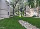 Landscaped grounds with a rock water feature at 15225 N 100Th St # 2187, Scottsdale, AZ 85260