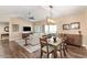 Spacious dining area with hardwood floors and a modern light fixture at 15225 N 100Th St # 2187, Scottsdale, AZ 85260
