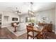 Open dining area with wood table, chairs and a view of living room at 15225 N 100Th St # 2187, Scottsdale, AZ 85260