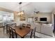 Open concept dining area with kitchen view and hardwood floors at 15225 N 100Th St # 2187, Scottsdale, AZ 85260
