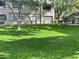 Well-manicured lawn area with mature trees at 15225 N 100Th St # 2187, Scottsdale, AZ 85260