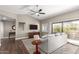Living area with hardwood floors, large window, and patio access at 15225 N 100Th St # 2187, Scottsdale, AZ 85260