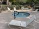 Community hot tub with surrounding lounge chairs at 15225 N 100Th St # 2187, Scottsdale, AZ 85260