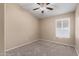 Spacious bedroom with ceiling fan and window shutters at 1562 W Flintlock Way, Chandler, AZ 85286