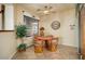 Cozy breakfast nook with a round table, comfortable chairs, and a large window offering natural light at 15891 W Avalon Dr, Goodyear, AZ 85395