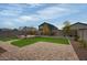 Artificial turf lawn with brick pavers and pergola at 19563 W Annika Dr, Litchfield Park, AZ 85340