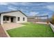 Large backyard with covered patio, artificial turf, and pergola at 19563 W Annika Dr, Litchfield Park, AZ 85340