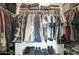 Large walk-in closet with ample hanging space and shelving at 19563 W Annika Dr, Litchfield Park, AZ 85340