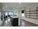 Modern kitchen with granite island and stainless steel appliances at 19563 W Annika Dr, Litchfield Park, AZ 85340