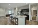 Modern kitchen with granite countertops and stainless steel appliances at 19563 W Annika Dr, Litchfield Park, AZ 85340