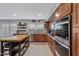 Modern kitchen with butcher block island and stainless steel appliances at 223 S Daisy Ln, Gilbert, AZ 85296