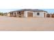 View of the home's side elevation, showcasing the garage at 22414 W Meade Ln, Buckeye, AZ 85326