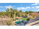 Aerial view showcasing a beautiful home, pool, and lush landscaping at 2536 E Wood Pl, Chandler, AZ 85249