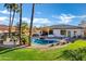 Luxury home with inviting backyard oasis featuring a sparkling pool and relaxing patio area at 2536 E Wood Pl, Chandler, AZ 85249