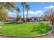 Expansive backyard with lush lawn, pool, and a view of the house at 2536 E Wood Pl, Chandler, AZ 85249