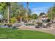 Inviting backyard with a refreshing pool, comfortable lounge chairs, and a shaded pergola at 2536 E Wood Pl, Chandler, AZ 85249