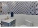 Powder room with navy hexagon patterned wallpaper and white shiplap at 2536 E Wood Pl, Chandler, AZ 85249