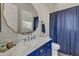 Clean bathroom with navy blue accents and a walk-in shower at 2536 E Wood Pl, Chandler, AZ 85249
