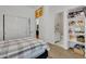 Bedroom with ensuite bathroom and built-in shelving at 2536 E Wood Pl, Chandler, AZ 85249