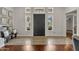 Bright and airy entryway with large mirrors and tile flooring at 2536 E Wood Pl, Chandler, AZ 85249