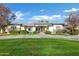 Single-story home with stone accents and a manicured lawn at 2536 E Wood Pl, Chandler, AZ 85249