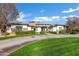 Beautiful home with a curving driveway and green lawn at 2536 E Wood Pl, Chandler, AZ 85249