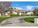 Elegant home with stone and stucco exterior, lush landscaping at 2536 E Wood Pl, Chandler, AZ 85249