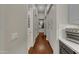 Long hallway with wood floors and built-in storage at 2536 E Wood Pl, Chandler, AZ 85249