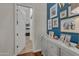 Hallway with a gallery wall and built-in storage at 2536 E Wood Pl, Chandler, AZ 85249