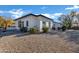 Side view of the house showcasing its clean lines and desert landscaping at 2536 E Wood Pl, Chandler, AZ 85249