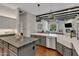 Modern kitchen with large island, stainless steel appliances, and white cabinets at 2536 E Wood Pl, Chandler, AZ 85249
