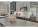 Modern kitchen features dark gray cabinets, marble countertops, and stainless steel appliances at 2536 E Wood Pl, Chandler, AZ 85249