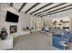 Relaxing living room featuring a fireplace, high ceilings, and ample natural light at 2536 E Wood Pl, Chandler, AZ 85249