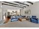 Spacious living room with cozy seating, exposed beams, and a fireplace at 2536 E Wood Pl, Chandler, AZ 85249