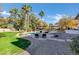 Relaxing pool area with lounge chairs and a view of the backyard at 2536 E Wood Pl, Chandler, AZ 85249