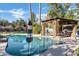 Inviting pool and pergola with stonework and comfortable seating area at 2536 E Wood Pl, Chandler, AZ 85249